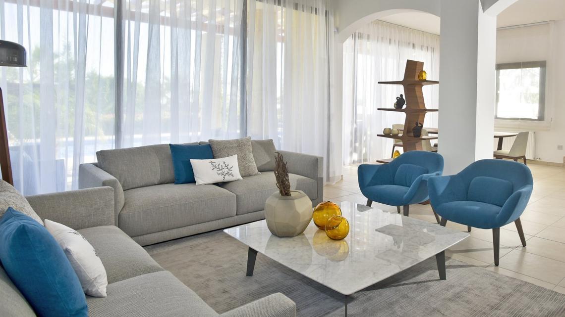 Mid-century, modern, unique, timeless, classy living room by Takis Angelides Furnihome Cyprus