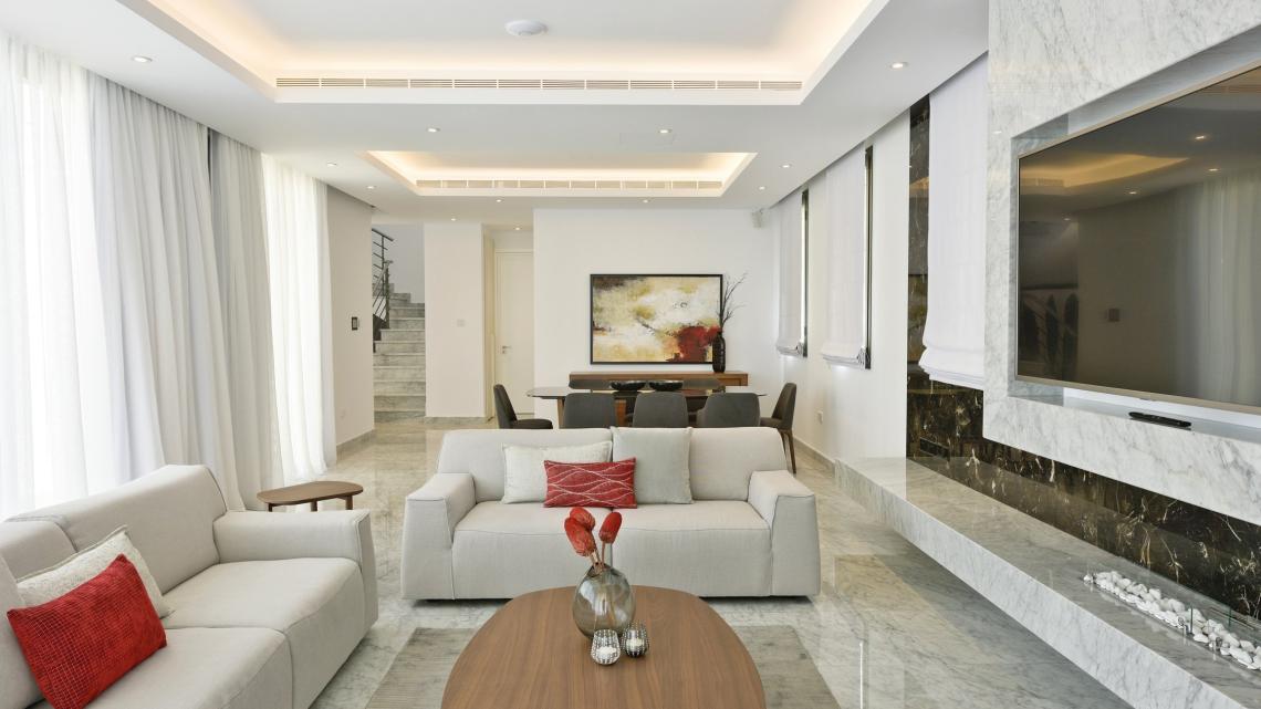 Modern Minimalist sleek simple warm inviting living room by Takis Angelides Furnihome Cyprus