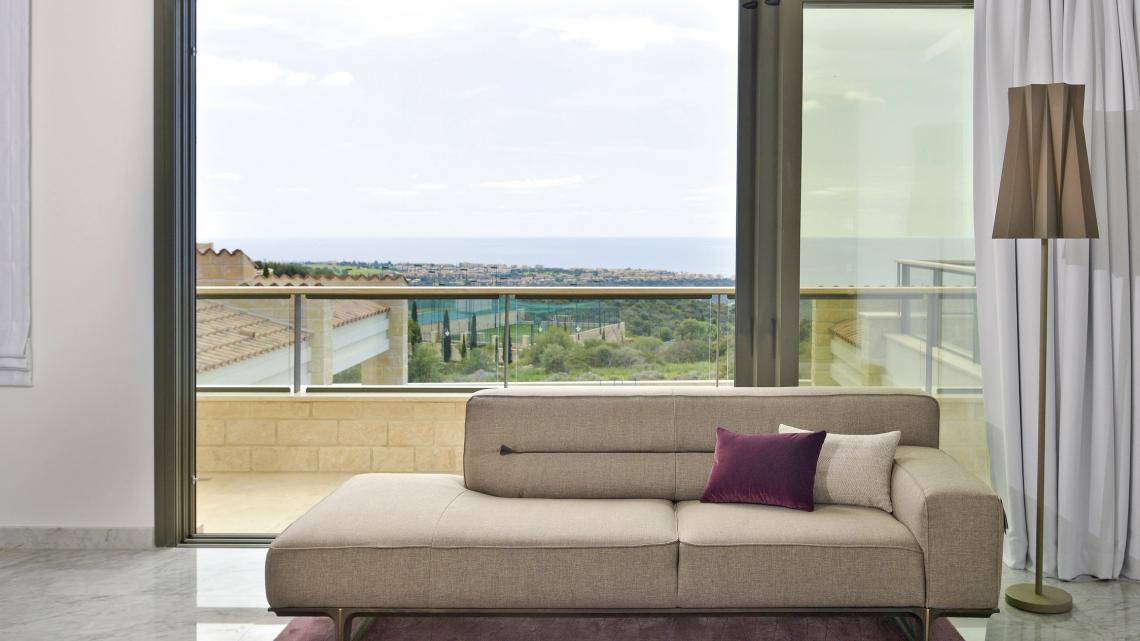Modern Minimalist sleek simple warm inviting living room by Takis Angelides Furnihome Cyprus